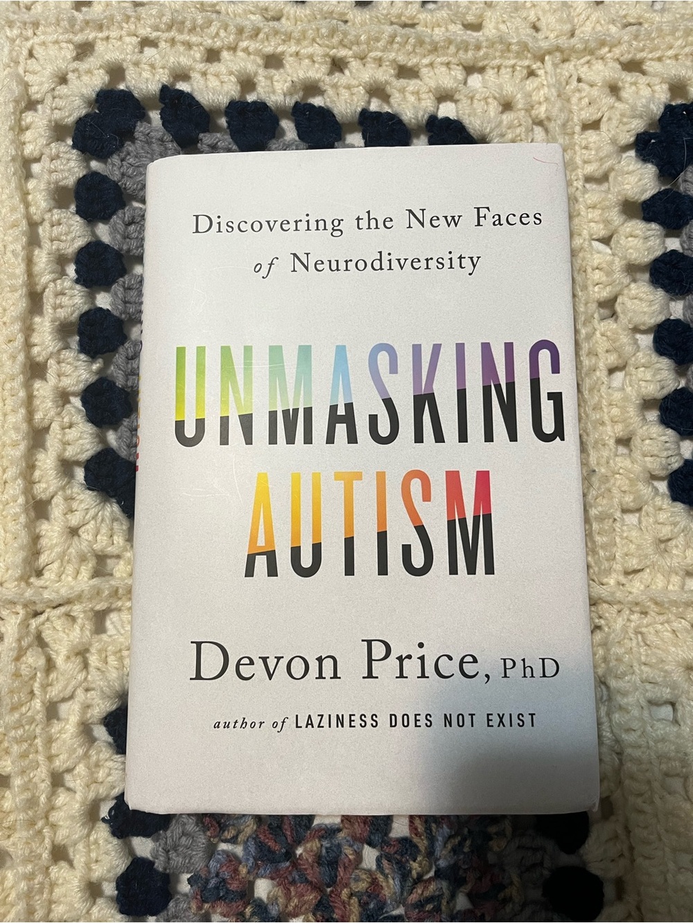 Unmasking Autism by Devon Price, PhD — White Cover with Rainbow Title
